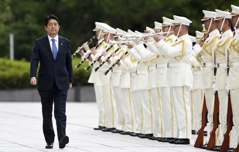 Japanese Prime Minister Shinzo Abe attends a ceremony at the Defense Ministry